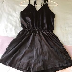 Black satin romper with strappy back